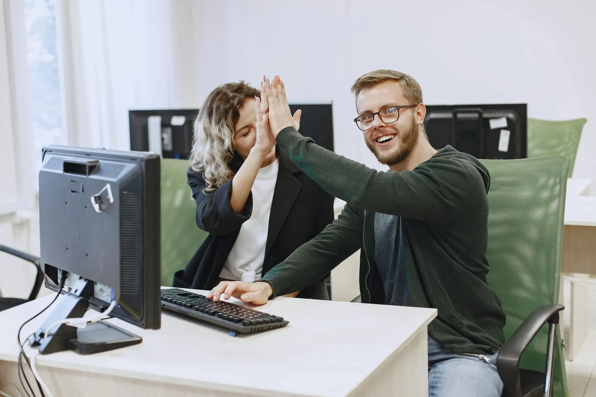 Security analyst reviewing network telemetry on multiple monitors searching for hidden threats in enterprise data